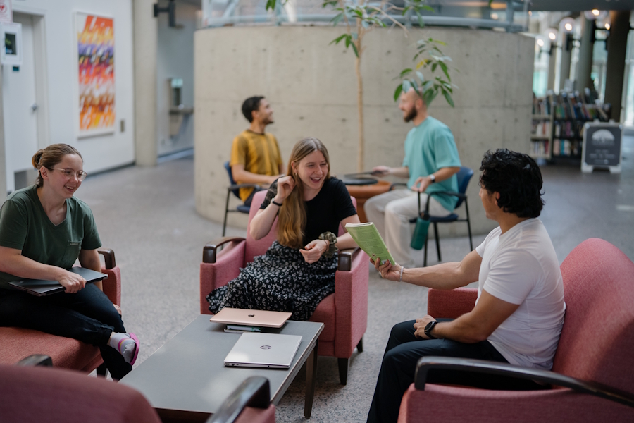 Groups of students chatting in Regent's Atrium